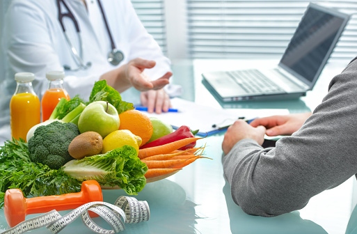 The Nutritionist Consults the Patient About a Healthy Diet with Vegetables and Fruits.