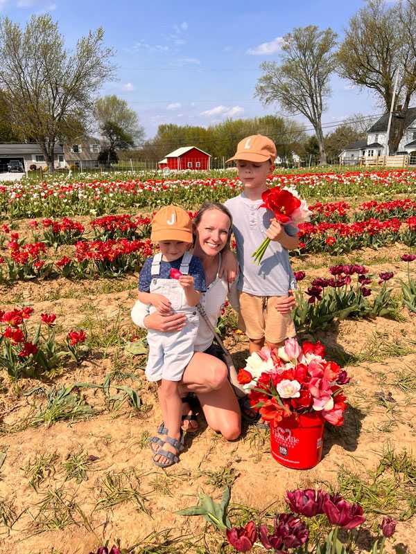 Hayley Kreisher with Her Two Children Picking Tulips in a Flower Field in Middleburg Heights, OH